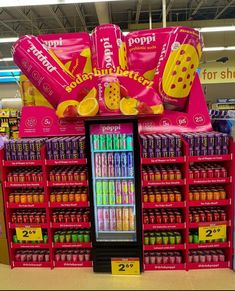 a display in a grocery store filled with lots of sodas and candy bar flavors