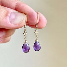 Amethyst Earrings, February Birthstone, Purple Teardrop Dangle Earrings, Minimalist Earrings Gold or Silver, Dainty Amethyst Jewelry Gift These precious delicate earrings feature Brazilian Amethyst teardrops adorned with a white topaz connector in either gold filled or sterling silver. The purple drop earrings are suspended from lever back ear wires in the finish of your choice. These earrings are very feminine and subtle, perfect for every day. These make a perfect daily earring, or a fantastic Elegant Amethyst Teardrop Dangle Earrings, Amethyst Teardrop Crystal Earrings, Elegant Purple Teardrop Crystal Earrings, Amethyst Gemstone Teardrop Dangle Earrings, Delicate Gemstone Drop Earrings, Hypoallergenic Amethyst Drop Earrings, Minimalist Purple Drop Earrings, Purple Teardrop Fine Jewelry Earrings, Elegant Amethyst Dangle Crystal Earrings