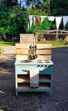 an outdoor kitchen made out of pallet wood