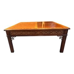 a wooden table with an intricate design on the top