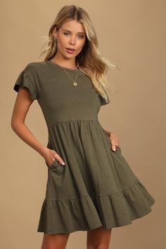 You'll be looking beyond precious in the Lulus Sweetest Style Olive Green Tiered Babydoll Dress! Lightweight stretch knit creates this super comfy dress with a crew neckline, short fluttery sleeves, and a relaxed bodice. A loosely-fitted waist tops the ruffle-trimmed mini skirt (with side seam pockets) that finishes off the babydoll silhouette. Pull-on design. Fit: This garment fits true to size. Length: Mid-thigh. Size medium measures 34.5" from shoulder to hem. Bust: Great for any cup size. Wa Fall Olive Green Dress, Cute Dresses Casual Modest Short, Olive Green Sundress, Juniors Dresses Casual, Farmhouse Fashion Clothes, Western Casual Dresses, Olive Green Dress Outfit Summer, Teacher Dresses Elementary, Tshirt Dress Fall