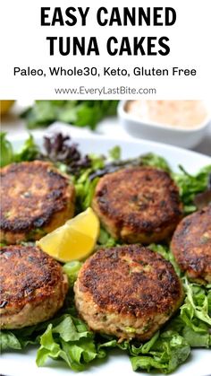 crab cakes with lettuce and lemon on a plate