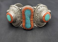 Handmade Very Old Silver Vintage Gerogues Bracelet With Natural Tinny Turquoise And Natural Big Coral Stone It's Very Unique Bangle Can't Find more Like this It's Tibeten Bangle Material Silver Gemstone Coral And Turquoise Size 7.5Cm Traditional Turquoise Round Bracelets, Traditional Round Turquoise Bracelet, Traditional Turquoise Round Bracelet, Traditional Turquoise Bangle Bracelets, Traditional Turquoise Bangle Bracelet, Unique Turquoise Earrings, Unique Bangle, Afghan Jewelry, Natural Turquoise Stone