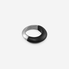 Half Black Jade and Half Silver.  A unique, minimalist, and luxurious statement ring. Beautiful on its own or worn as part of a sculptural stack.  With soft matte black jade married with polished sterling silver.     6mm wide band  Size 6    Please take great care when handling or wearing as these stones are fragile by nature and may crack or break upon impact with a hard surface.    Also available in Zebra Stone + Green gold, Lapis + 22k gold, Rose Quartz + 14k Rose Gold, and Smokey Quartz + Brown gold. Black Jade, Jewelry Studio, Stone Collection, Smokey Quartz, Wide Bands, 22k Gold, Black Rings, Ring Bracelet, Statement Ring