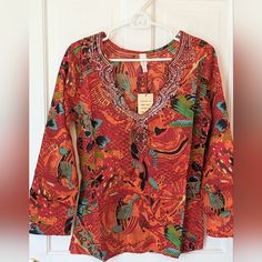 Brand New Beautiful Raga For Anthropologie Lightweight Floral And Sequin Boho Top! Perfect For Vacation, Resort Wear, Or Summer. The Print Is Red And Orange With Pops Of Other Colors. Sequin Design At The Neckline, Sleeves, And On The Back. Truly Gorgeous! This Blouse Is No Longer Available Online! Brand: Raga Style: 153 Condition: New With Tags Pattern: Floral Print Size: Medium Made In India Questions? Leave A Comment Below! Vibrant V-neck Blouse For Beach, Red Summer Tunic Top, Orange Vibrant Print Beach Blouse, Orange Vibrant Print Blouse For Beach, Red Tunic Tops For Spring, Vibrant Red Summer Tops, Cotton V-neck Blouse For Beach Season, Vibrant Cotton Tops For Beach, Red Tunic Blouse For Summer