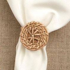 a close up of a napkin with a woven ring on it's center piece