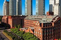 an aerial view of the city with tall buildings