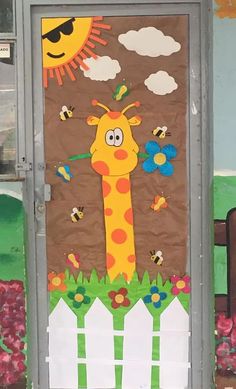 a door decorated to look like a giraffe with bees and flowers on it