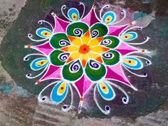 a colorful flower is painted on the ground