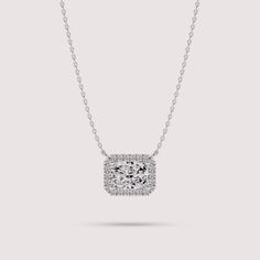 Elevate your style with this exquisite necklace crafted from 14K white gold. The centerpiece features a radiant cut solitaire lab diamond encircled by a dazzling halo of smaller lab diamonds, creating a mesmerizing cluster effect. With its timeless elegance and sophisticated design, this necklace is sure to become a cherished piece in your jewelry collection. ✤𝐃𝐢𝐚𝐦𝐨𝐧𝐝 𝐃𝐞𝐭𝐚𝐢𝐥𝐬 Color: F Clarity: VS1 Shape: Radiant Cut Carat Weight: 1 CT Approx. (5*7 MM) Type: Lab Diamond ✤ 𝐒𝐢𝐝𝐞 𝐃𝐢𝐚𝐦𝐨𝐧𝐝 𝐃𝐞𝐭𝐚𝐢𝐥𝐬 Color: F Clarity: VS1 Shape: Round Carat Weight: 0.12 CT Type: Lab Diamonds ✤Metal 𝐃𝐞𝐭𝐚𝐢𝐥𝐬 Metal Purity: Solid 14K Gold Metal Tone: Yellow, White, Rose Stamp/Hallmark: Yes Jewelry Certificate: Free of Cost with Listed Design Chain Length: 16″ inch Classic Halo Diamond Necklace In Cubic Zirconia, Classic Cubic Zirconia Halo Diamond Necklace, Classic Cubic Zirconia Diamond Necklace With Halo, Classic Diamond Halo Necklace, Classic Diamond Necklace With Halo Detail, Classic White Gold Solitaire Necklace With Radiant Cut, Classic White Gold Radiant Cut Solitaire Necklace, Classic Radiant Cut Solitaire Necklace In White Gold, Luxury Silver Diamond Necklace With Halo