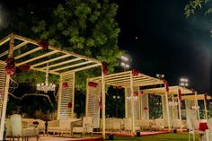 an outdoor wedding venue set up at night