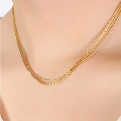 18K Gold-Plated Multi-Layer Clavicle Chain Necklace Elevate your style with the exquisite 18K Gold-Plated Multi-Layer Clavicle Chain Necklace, a luxurious piece that effortlessly enhances any ensemble. Crafted with precision and elegance, this necklace is designed to rest gracefully on your collarbone, adding a touch of sophistication to your everyday look. Key Features: Premium Material: Made from high-quality titanium steel and plated with 18K gold, ensuring durability and a radiant finish. El Gold Clavicle Chain Necklace In Fine Jewelry Style, Gold Clavicle Chain Necklace Fine Jewelry, Dainty Yellow Gold Plated Chain Necklace, Gold Multi-strand Chain Necklace In Luxury Style, Luxury Gold Multi-strand Chain Necklace, Luxury Multi-strand Gold Chain Necklace, Elegant Plated Yellow Gold Chain Necklace, Delicate Gold Snake Chain Necklace, Yellow Gold Multi-strand Clavicle Necklace