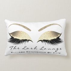 the lashes lounge pillow with gold glitter eyes