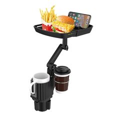 a cell phone is on top of a tray with food and drinks in front of it