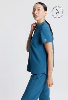 MADE FOR THE WAY YOU MOVE™: Stylish & Functional ¼ zip Scrub Top. You’ll love the stretchy, lightweight & breathable fabric with a relaxed fit that drapes nicely, leaving room to layer. The back features a box pleat for added range of movement and a water-repellant treatment to keep you confident during your shift. These scrubs wash up like new and customers rave over the flattering fit and how easy it is to put on and take off with the zipper. Bonus: They are made with sustainable fabric. Mens Workout Pants, Leaving Room, Caribbean Blue, Medical Scrubs, Round Neck Tees, Recycled Bottles, Box Pleats, Sustainable Fabrics, Scrub Tops