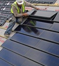 a man working on the roof of a building