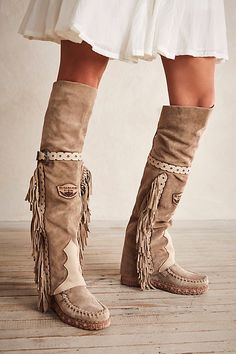 Italian made suede moccasin inspired boots featuring an over the knee fit, fringe trim and belted details.* Lace-up back* Padded insole Native American Boots, Boots Boho, Handmade Moccasins, Free People Boots, Skor Sneakers, Boho Boots, Rodeo Outfits, Faux Suede Boots, Suede Moccasins