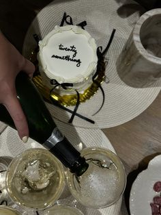 a person is pouring champagne into wine glasses