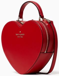 Kate Spade Love Shack Heart Crossbody Red Saffiano PVC Color Code: candied cherry (600) New with Tags; Authenticity Guaranteed! WKR00339 / Retail $349 roduct descriptionsomething else to love: this heart-shaped purse, perfect for carrying all the things, minus all the bulk. keeps hands free for hot group texts and lattes. comes in red and pink. get ready for everyone to ask where you got that adorable heart bag.  Product Details 7.48"h x 8.27"w x 2.36"d handle drop: 2.5" strap drop: 22" saffiano pvc metal pinmount logo two way spade jacquard lining interior front slip pocket zip around closure imported dust bag not included Style No. WKR00339 . v.617 AMERICAN STARLEX GUARANTEE ALL STOCK IS KEPT IN SMOKE/PET-FREE WAREHOUSE BUY WITH CONFIDENCE: · Everything we sell is BRAND NEW & AUTHENTIC a Heart Crossbody Bag, New York Love, Kate Spade Heart, Cherry Candy, Kate Spade Outlet, Red Purses, Heart Bag, Leather Crossbody Purse, Personalized Accessories