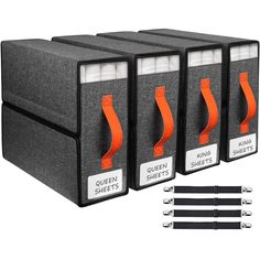 four black and orange file folders with white labels on them, each containing an orange ribbon