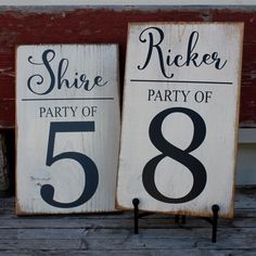 two wooden signs that say strike and party of the number three, with black numbers on them