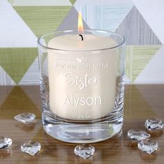 a candle that is sitting on a table with some crystal stones around it and the words, 40 years as mr & mrs bennet