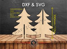 wooden christmas trees on a table with measurements