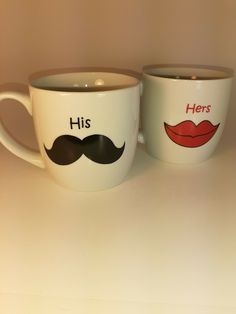 two coffee cups with mustaches painted on them