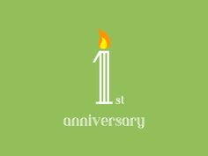 a candle with the word st anniversary on it and an orange flame in the middle