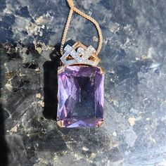 Size: 16mm x 29mm Chain: 42cm Metal Type: 14 k Gold   Weight: 10.4 grams Stones: Amethyst, Diamonds Diamonds: 0.1 ct. Cut: Single cut Clarity: Si Color: J Condition: Excellent Stunning amethyst and diamond Art Deco Pendant. The amethyst has a charming, magical  purple color and the altogether 0.1 ct. diamonds with J color and Si clarity compliment it very well. The pendant weighs 10.4 grams and is 29 mm long and 16 mm wide. The pendant has a stunning Art Deco design. This necklace  would be a pe Formal Rose Gold Amethyst Necklace, Gold Amethyst Jewelry With Diamond Accents, Luxury Purple Rectangular Jewelry, Elegant Amethyst Rectangular Stone Jewelry, Elegant Amethyst Jewelry With Rectangular Stone, Formal Amethyst Pendant Gemstone, Luxury Rectangular Amethyst Jewelry, Purple Rectangular Jewelry For Formal Occasions, Formal Engraved Purple Jewelry