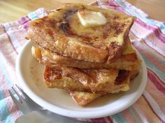 a stack of french toast with butter on top