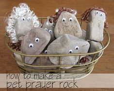 some rocks are sitting in a basket with eyes on them and the words how to make a pet prayer rock