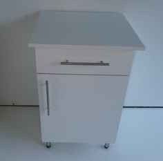 a white refrigerator freezer sitting on top of a floor