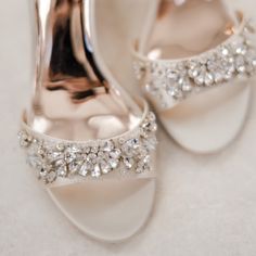 the bride's shoes are adorned with crystal stones