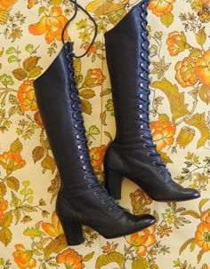 Out of this world vintage late 1960s leather gogo boots.  Made from a supple leather in a deep muted navy shade.  Tapered heel and lace up design with eyelets and hooks, original laces and leather soles.  Victoriana, medieval revival style evocative of the late 1960s era and psych scene.  Highly sought after and in excellent condition. LABEL: Paputsi of Greece FABRIC: Leather outer, leather interior (lined with fabric that appears to be man made) and leather soles. CONDITION: Great vintage condi 1960s Medieval Revival, Vintage Leather Knee-high Lace-up Boots, Vintage Knee-high Boots, Vintage Blue Leather Boots, Vintage Knee-high Lace-up Boots For Fall, Vintage Knee-high Lace-up Winter Boots, Vintage Knee-high Lace-up Boots For Winter, Vintage Wide Calf Knee-high Heeled Boots, Vintage Knee-high Boots For Formal Occasions