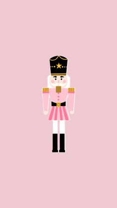 a nutcracker is standing in front of a pink background