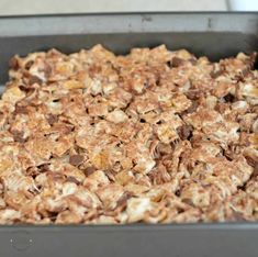 a pan filled with cereal sitting on top of a counter