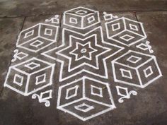 a white drawing on the ground with squares and stars drawn in it's center