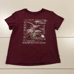 Maroon Graphic T-Shirt. Only Worn Once, Brand New With Tag. Casual Vans T-shirt With Graphic Print, Vans Graphic Short Sleeve T-shirt, Vans Graphic Print Crew Neck T-shirt, Vans Graphic Print T-shirt With Relaxed Fit, Vans T-shirt With Graphic Print And Relaxed Fit, Vans Short-sleeved Graphic Tee, Vans Relaxed Fit Graphic T-shirt, Vans Graphic Tee With Screen Print, Vans Cotton Graphic Tee