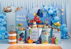 an under the sea themed birthday party with balloons and decorations, including fish cake pops