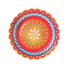 an orange, blue and red plate with flowers on the rim is sitting in front of a white background