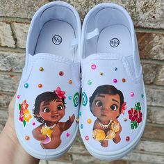 Two different images of Baby Moana as shown with beautiful bling pearls and crystals, flowers, etc, just as shown. Choose your child's shoe size during check out. Fast shipping! Moana Shoes, Disney Silhouette Art, Baby Moana, Disney Silhouette, Moana Birthday, Disney Shoes, Disney Moana, Cute Sneakers, Sneakers Athletic