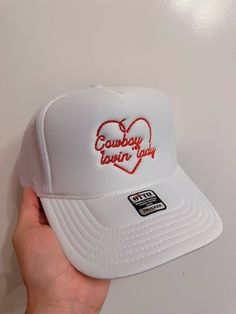 Yeehaw! This embroidered trucker hat is the perfect addition to any cowgirl's wardrobe. With its stylish design and breathable mesh back, you'll love rockin' this hat on all your adventures. Don't miss out on this must-have accessory for any Cowboy lovin' lady! Adjustable Trucker Hat With Embroidered Logo, Adjustable White Country Trucker Hat, White Adjustable Country Trucker Hat, Adjustable White Country Style Trucker Hat, White Adjustable Country Style Trucker Hat, Trucker Hat For Rodeo, One Size Fits Most, Trendy White Trucker Hat For Rodeo, White Adjustable Trucker Hat For Rodeo, Western Style Adjustable Trucker Hat With Curved Bill