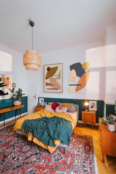 a bed sitting in a bedroom next to a wooden dresser and lamp on top of a rug