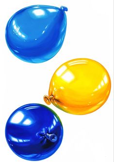 two blue and yellow balloons are in the air