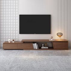 a modern living room with a large flat screen tv mounted on the wall above it