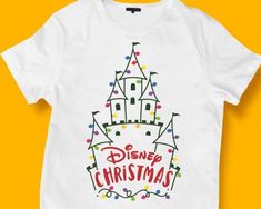 a white t - shirt with the words disney christmas written on it