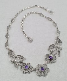 Handmade Genuine Natural Purple Amethyst and 925 Solid Sterling Silver Artisan Crafted Filigree Statement Necklace Matching earrings are available https://www.etsy.com/listing/1316810863/natural-amethyst-silver-earrings-925?ref=listings_manager_grid Material: 925 Solid Sterling Silver, 925 Stamped Natural Amethyst Gemstone dimension: 6 mm, Round, Faceted, approximately total carat weight: 3 Necklace Length: 19 inches, adjustable down to 16 inches is desired Closure: Lobster claw clasp Finishing: Filigree Silver Jewelry, Bridal Necklace Designs, Jewellery Design Sketches, Necklace Matching, Filigree Necklaces, Filigree Jewelry, Fine Silver Jewelry, Magical Jewelry, Silver Jewelry Design