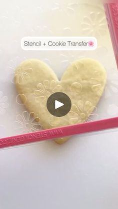 a cookie in the shape of a heart on a card