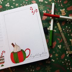 an open notebook with christmas decorations and candy canes